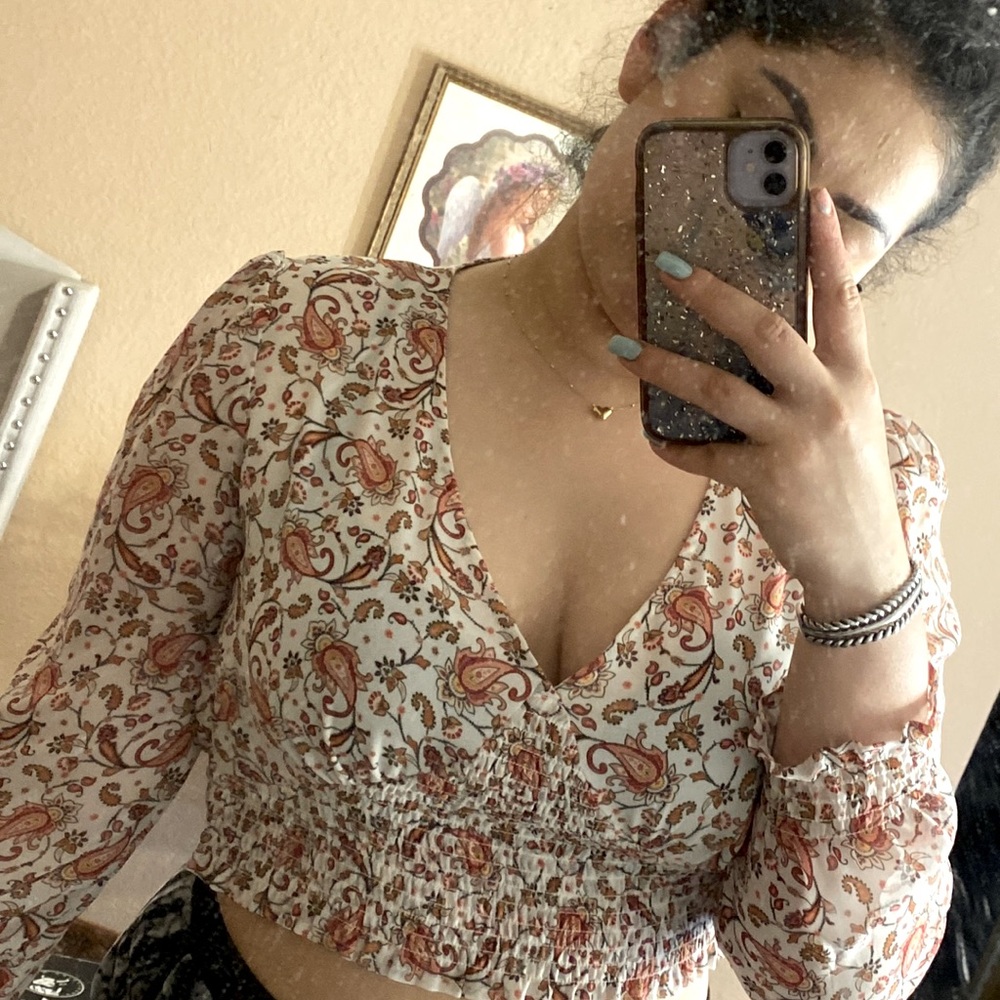 Pink and white patterned blouse